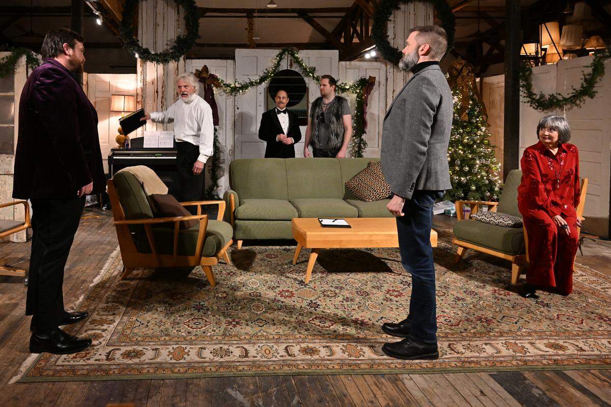 Philip (Nick Vannoy) and Henry (Kevin Hardesty) argue while Henry’s family — Geoffrey (Tim Hull), John (Tanner Gray), Richard (Shayne Brakefield) and Eleanor (Missy Johnston) — watch in the living room. On the Verge Theatre presents “The Lion in Winter” at Luigart Studio, 110 Luigart Court in Lexington, Kentucky, Jan. 23-Feb. 1. This photo was taken at a rehearsal Jan. 17, 2025.