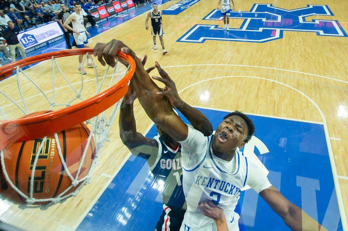 Kentucky’s Adou Thiero (3) dunks against Gonzaga big man Graham Ike (13) during UK’s 89-85 loss to the visiting Zags on Saturday at Rupp Arena. In a high-energy performance, Thiero had 15 points, five rebounds, two assists, three blocked shots and a steal for UK in the game.