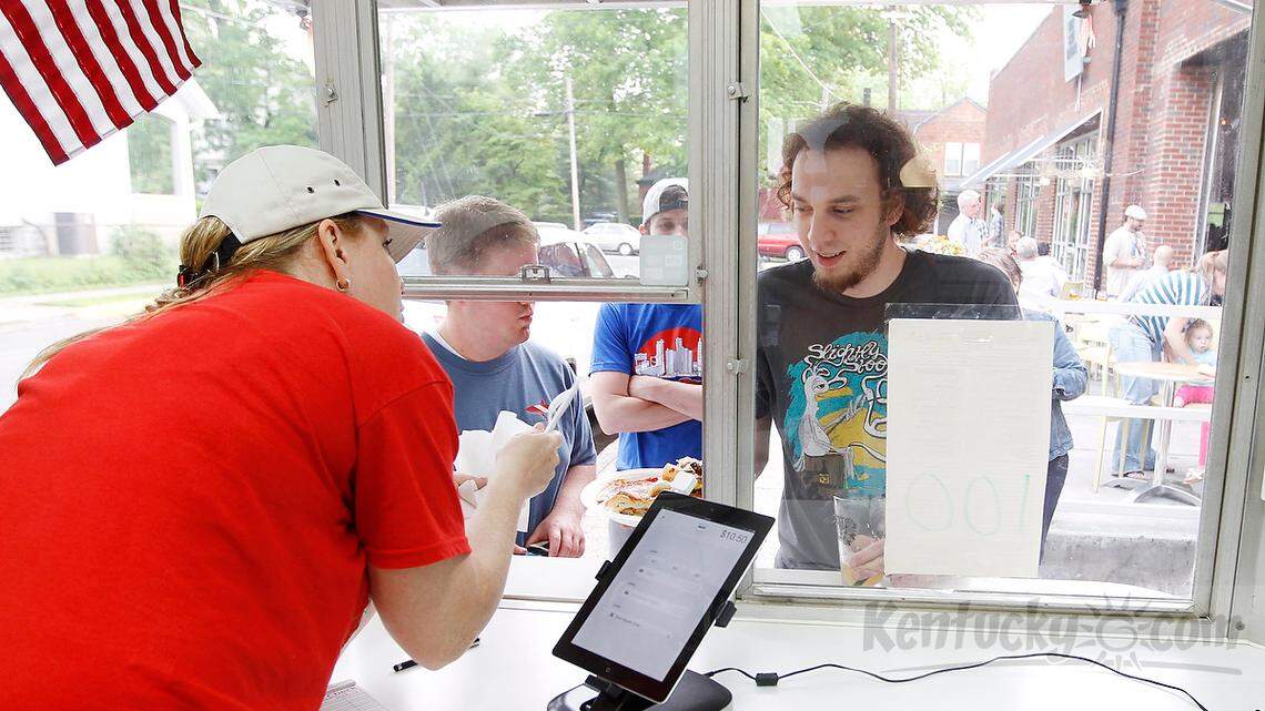 Jessica Noto served Jordan Todd at Mia Nonni food truck outside West Sixth Brewing Company in Lexington, Ky., on May 16, 2013. Photo by Pablo Alcala | Staff