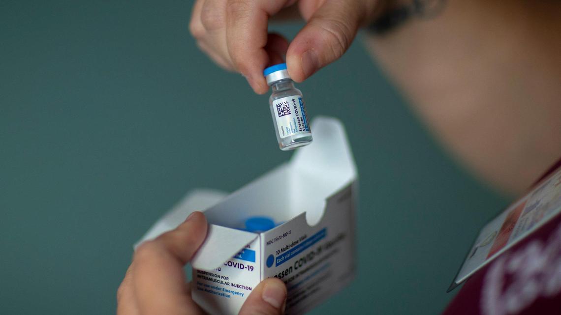 Linda Stahl, Buffalo District Health Department clinic nurse, holds a vial of a COVID-19 vaccine at the Germantown, Ky., community center and volunteer fire department on Wednesday, July 14, 2021.