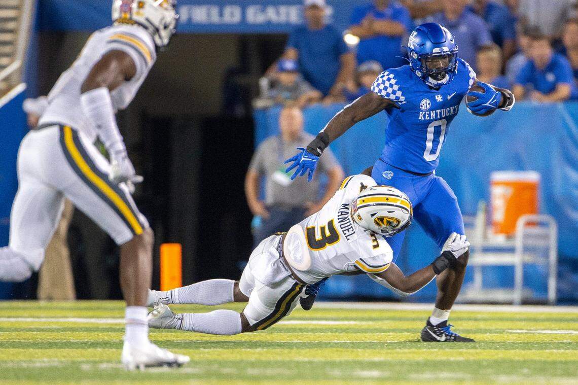 Missouri’s Martez Manuel (3) tried to bring down Kentucky running back Kavosiey Smoke (0) in UK’s 35-28 win over Mizzou last season at Kroger Field. Manuel said this past summer he considers UK to be Missouri’s foremost SEC rival. “I hate that white and blue, I’m not going to lie to you,” Manuel said.