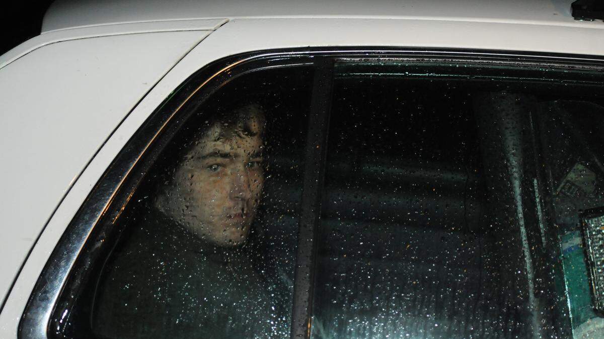 A man identified by police as Dalton Stidham was driven away from the state police post in Hazard to the Hazard Police Department after the shooting that killed three.