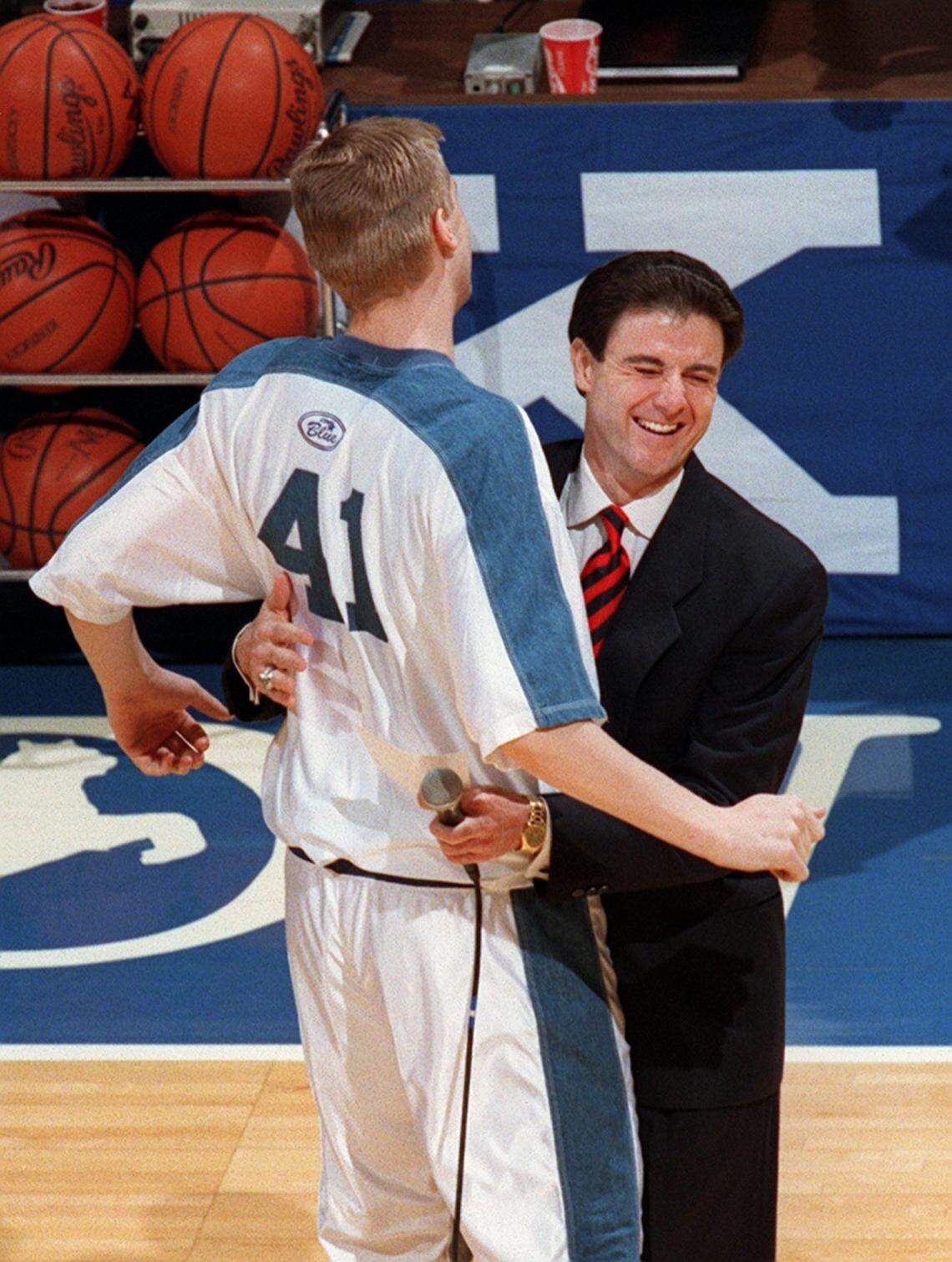 Mark Pope chest-bumps coach Rick Pitino on Senior Day in Rupp Arena in 1996. The current UK coach also chest-bumped Pitino during a game at Vanderbilt.