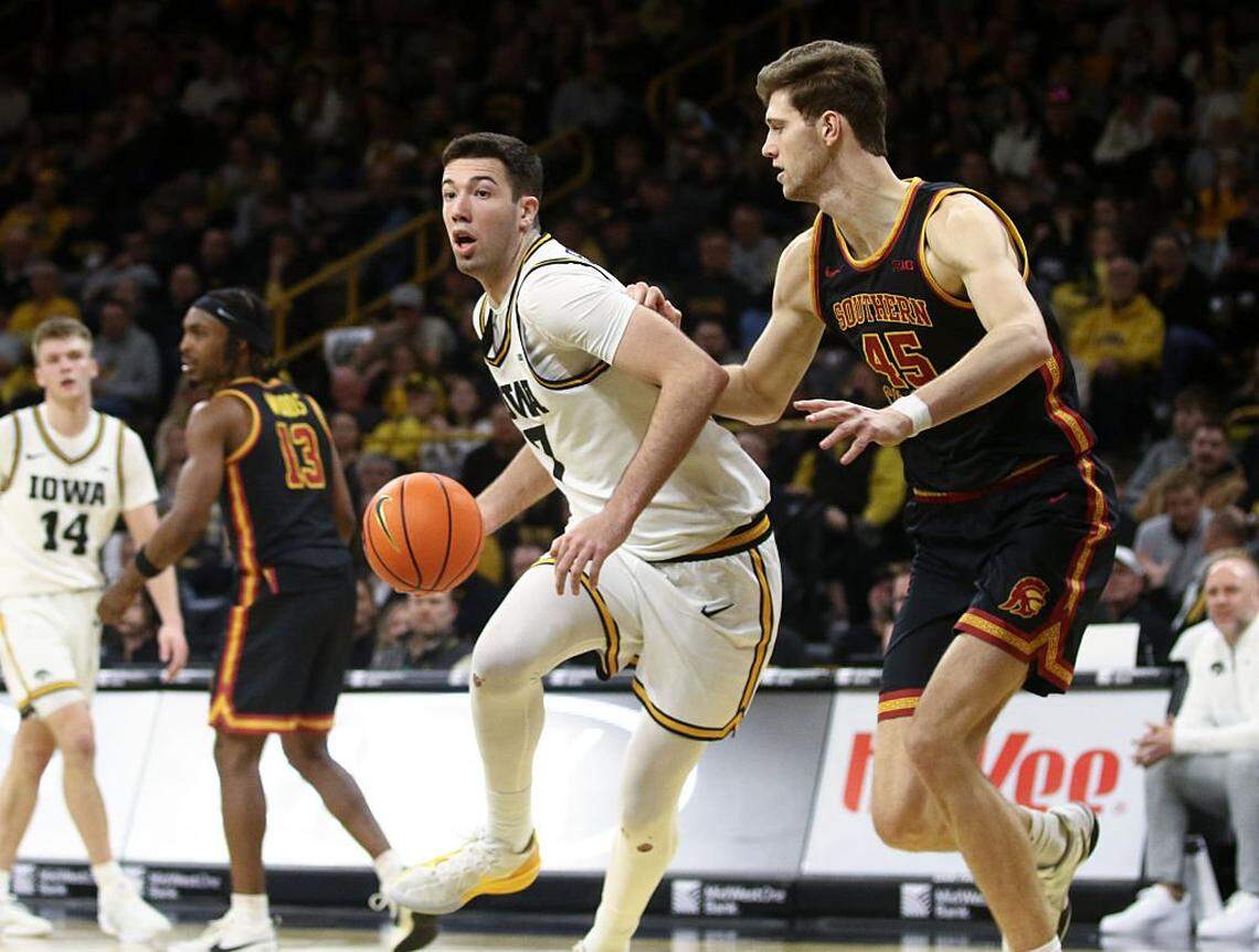 IOWA CITY, IA - JANUARY 28: Forward Alvaro Folgueiras #7 of the Iowa Hawkeyes goes to the basket in the second half against center Gabe Dynes #45 of the USC Trojans on January 28, 2026 at Carver-Hawkeye Arena, in Iowa City, Iowa. (Photo by Matthew Holst/Getty Images)