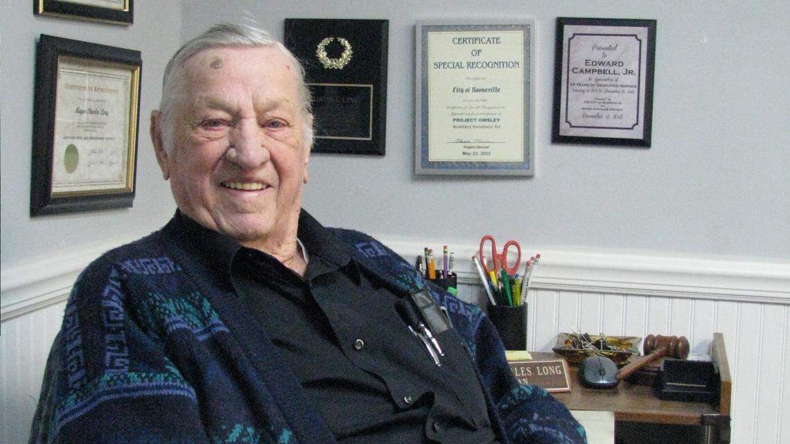 Booneville Mayor Charles E. Long, 94, surrounded by plaques in the city council chamber, has been mayor of the  Owsley County seat since 1959, which the Kentucky League of Cities says makes him the state's longest-serving mayor.   