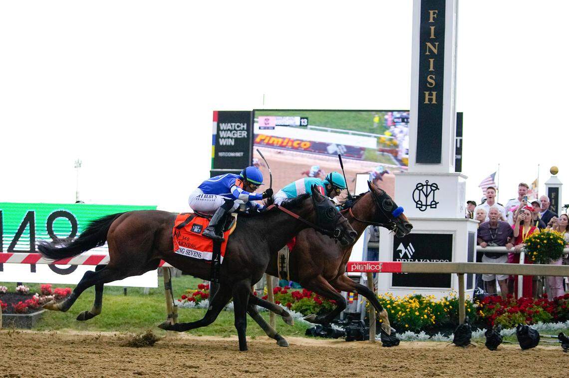 National Treasure, right, with jockey John Velazquez, edges out Blazing Sevens, with jockey Irad Ortiz Jr., to win the 148th Preakness Stakes at Pimlico Race Course in Baltimore on Saturday.
