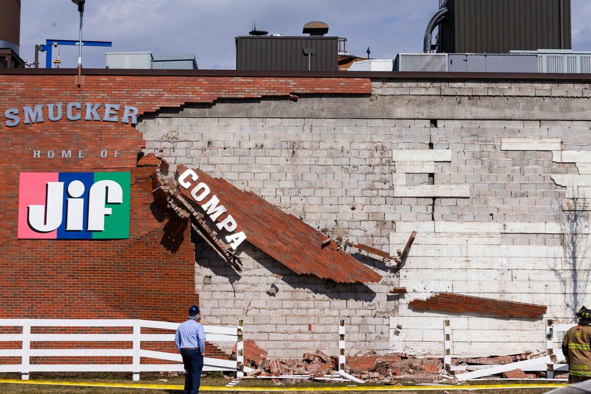 Part of a wall on at the J. M. Smuckers factory on Winchester Road falls in Lexington Ky., Wednesday, February 24, 2021.