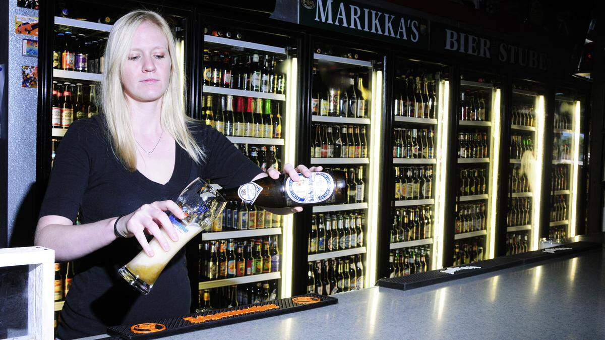 Bartender Johanna Taylor poured a glass of Weihenstephaner Hefe Wessbier, a German wheat beer, at Marikka's Bier Stube.  