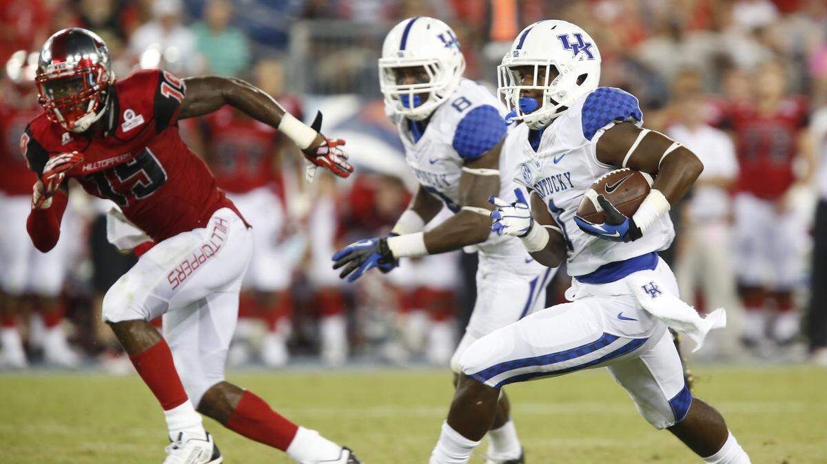 UK's Ryan Timmons, with ball, is working on his ball security, but meanwhile his coaches know they need him on the field.  