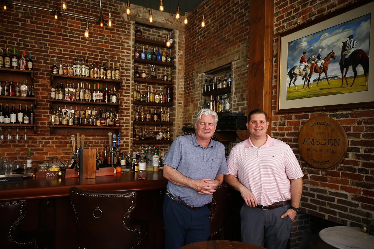 Charlie O’Connor, left, and Jon Rabinowitz, both of Versailles, co-owners of The Amsden Bourbon Bar Tuesday at The Amsden Bourbon Bar in Versailles. The Amsden Bourbon Bar is open daily and features seasonal and classic cocktails.