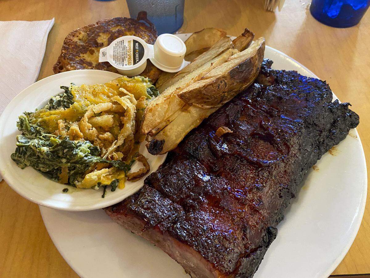 Ribs, served with spinach, potato wedges and cornbread at Thoroughbred Restaurant, located at 1483 Leestown Rd. The longtime Lexington restaurant, which opened in 1954, is known for daily menu specials written on a chalkboard.
