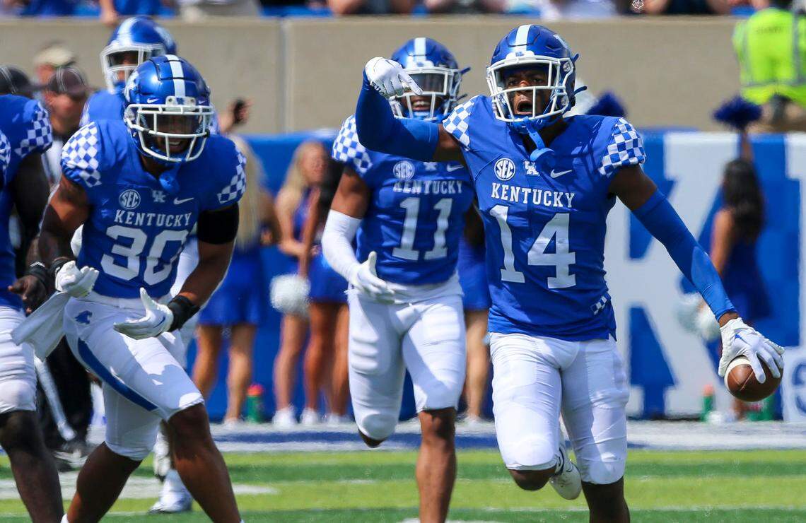 Kentucky defensive back Carrington Valentine (14) celebrates a second-half interception against Youngstown State on Saturday at Kroger Field.