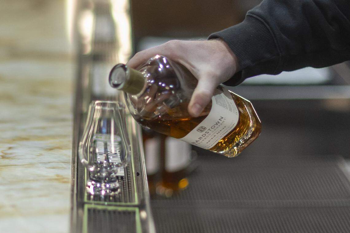Vince Metcalfe, single barrel program coordinator at Bardstown Bourbon Company, pours the company's origin series straight bourbon at the distillery in Bardstown, Ky., on Wednesday, Nov. 19, 2025.