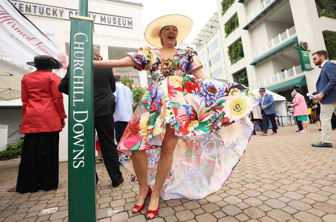 Angie Bush wears a flowered dress at Churchill Downs in Louisville, Ky., Saturday, May 7, 2022. She said she found the dress for $70 an “it screamed Derby.”