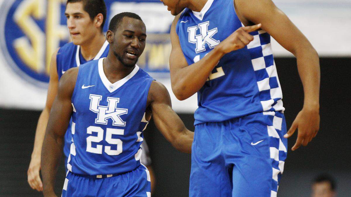 UK's Dominique Hawkins is congratulated by teammate Karl-Anthony Towns after Hawkins defense forced a five second call giving the ball back to the Cats.

The University of Kentucky men's basketball team falls to the Dominican Republic National Team 63-62 on Sunday, August 17, 2014, at the Kendal G.L. Isaacs National Gymnasium in Nassau, Bahamas.

Photo by Chet White | UK Athletics