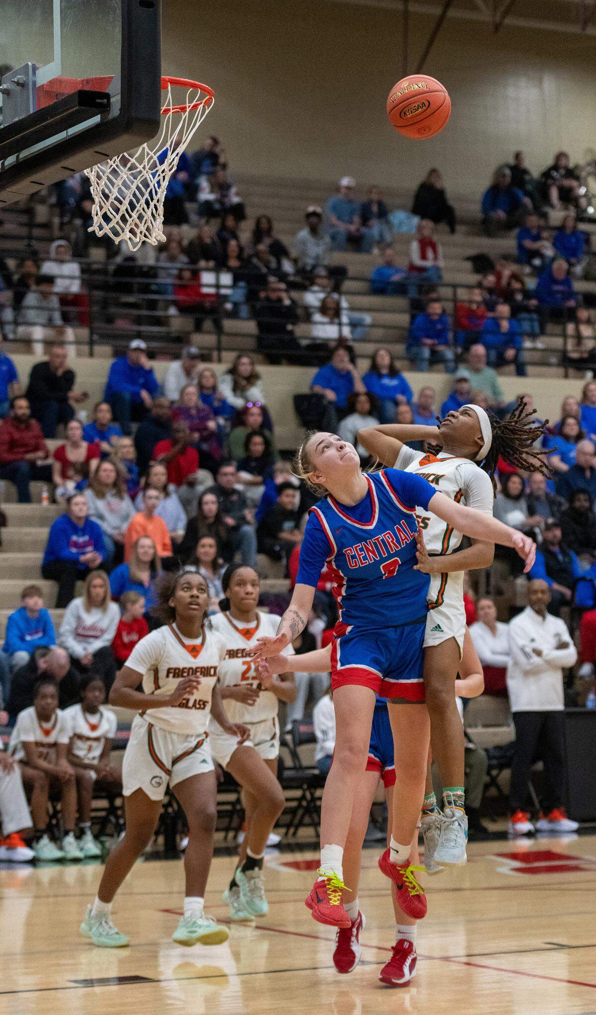 Mikalee Bennett of Frederick Douglass shoots over Madison Central’s Cameryn Ridderikhoff for two of her 12 points in the Broncos’ 68-41 win in the 11th Region Tournament finals.