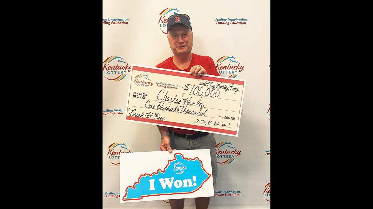 Charles Hanley of Lexington, Ky., poses with his big check after winning $100,000 on a Kentucky Lottery scratch-off ticket recently.
