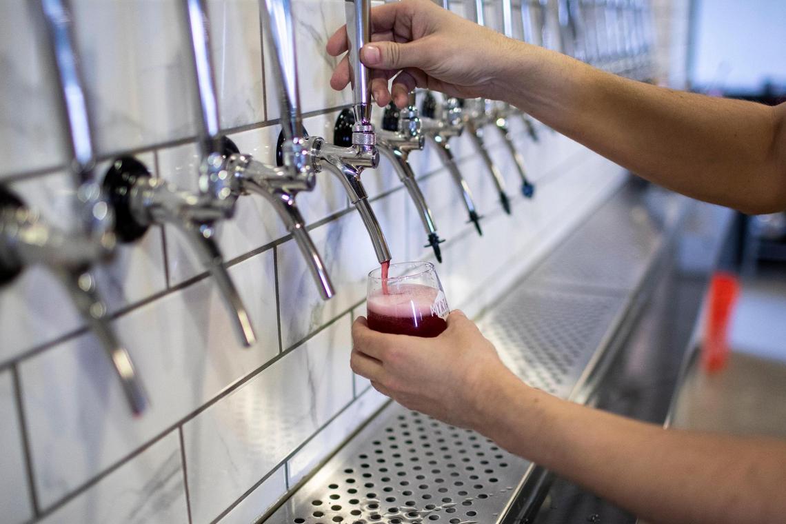 Co-owner Douglas Price pours a flight of mead at Myriad Meadery on National Avenue. Several varieties will be low alcohol “spritzers” but they also will have higher-alcohol versions.