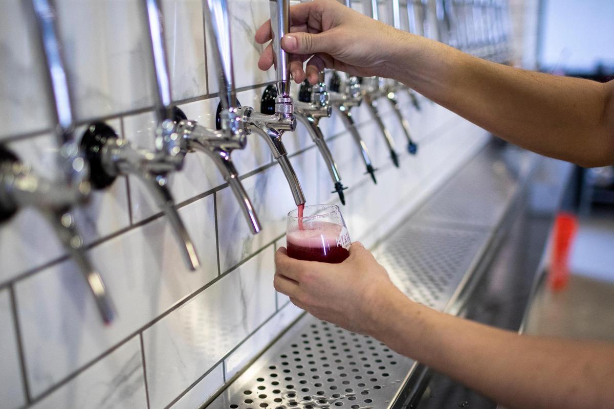 Co-owner Douglas Price pours a flight of mead at Myriad Meadery on National Avenue. Several varieties will be low alcohol “spritzers” but they also will have higher-alcohol versions.