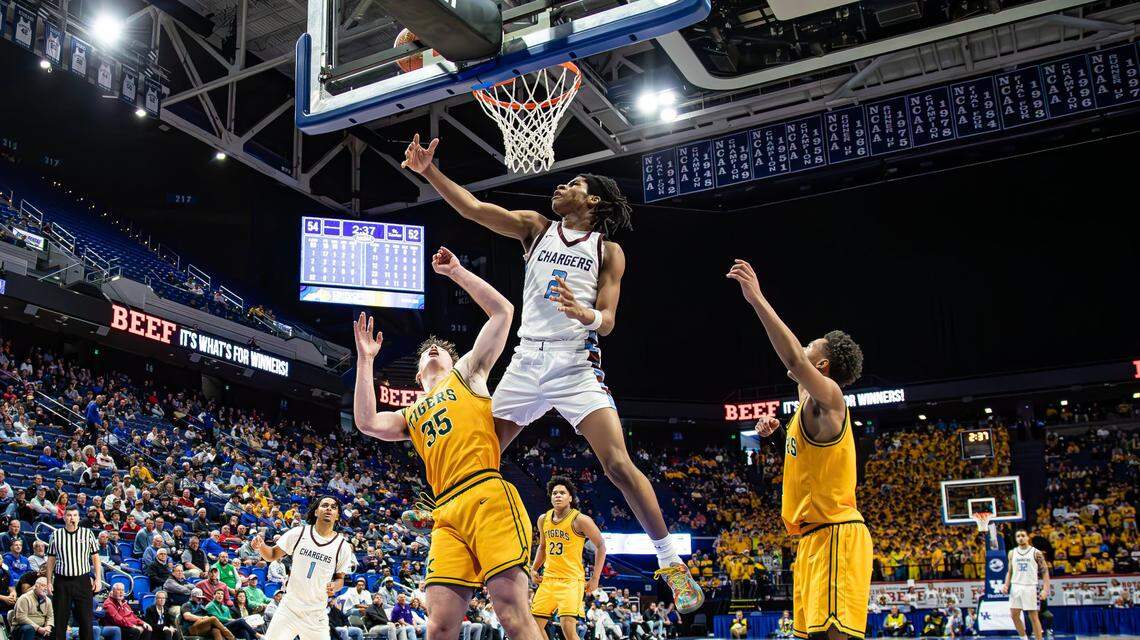 Jeffersontown’s Damere Clark (2) skies for a rebound against St. Xavier during Wednesday’s game.