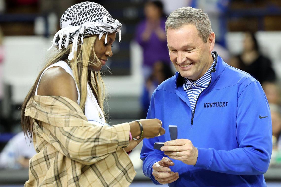 Kentucky athletics director Mitch Barnhart, shown presenting former women’s basketball star Rhyne Howard her 2022 SEC Tournament championship ring, promised in a UK news release Monday to conduct “a national search” for a new women’s basketball head coach.