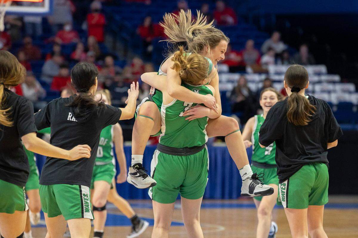 Meade County’s Annabelle Babb (11) and Sage Crawley (34) embrace following their win over Boyd County in the opening game of the Girls’ Sweet 16 in Rupp Arena on Wednesday.