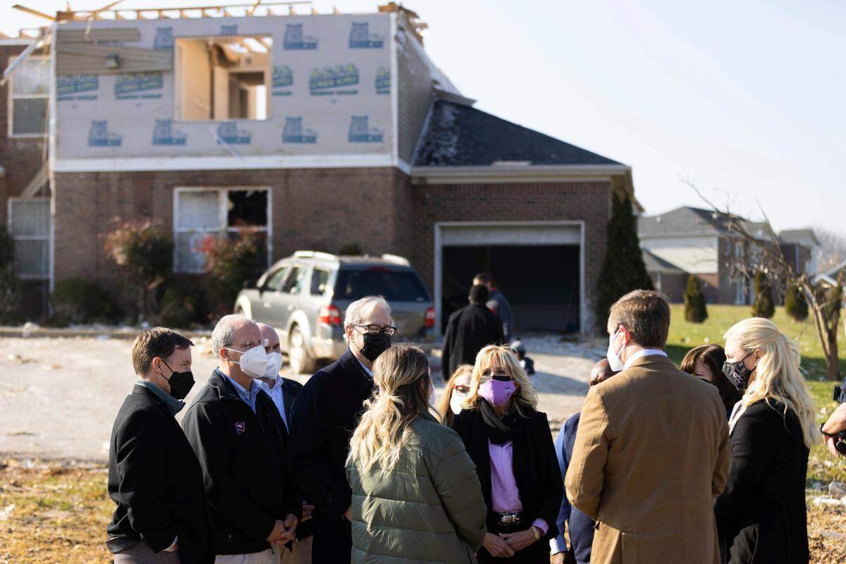 First lady Jill Biden listens to a resident of the Creekwood neighborhood that was hit by a tornado in Bowling Green, Ky., Friday, Jan. 14, 2022. (AP Photo/Michael Clubb)