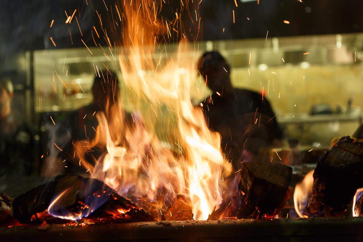 Firebirds cooks steaks, chicken and seafood over a wood-fired open-flame visible from the dining room.