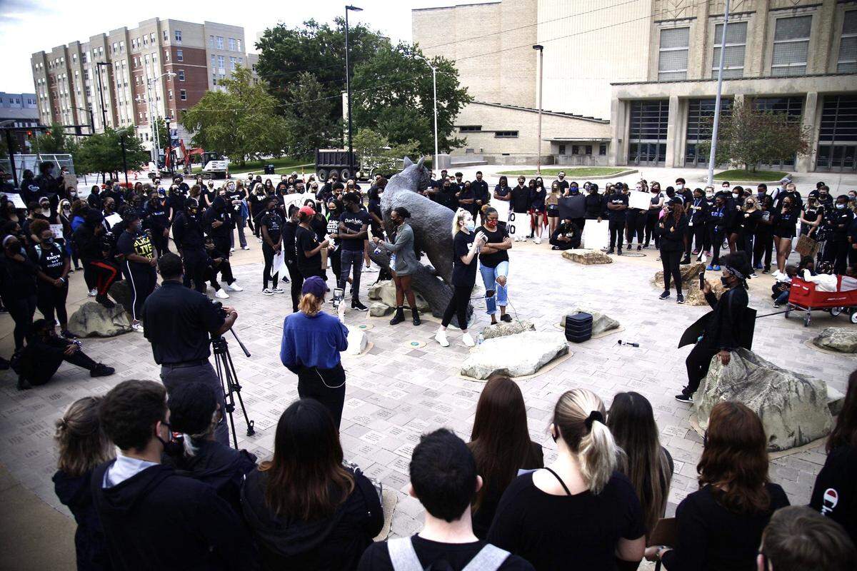 Students gather around the wildcat statue on UK’s campus for a vigil to honor Breonna Taylor after the grand jury decision concerning the officers involved in her killing yesterday.