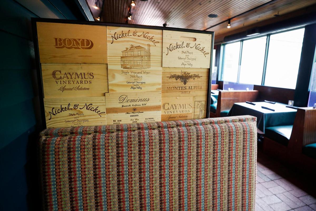 Old wine boxes are used for seat backs at The Goose of Lexington in Lexington, Ky., Wednesday, May 5, 2021.