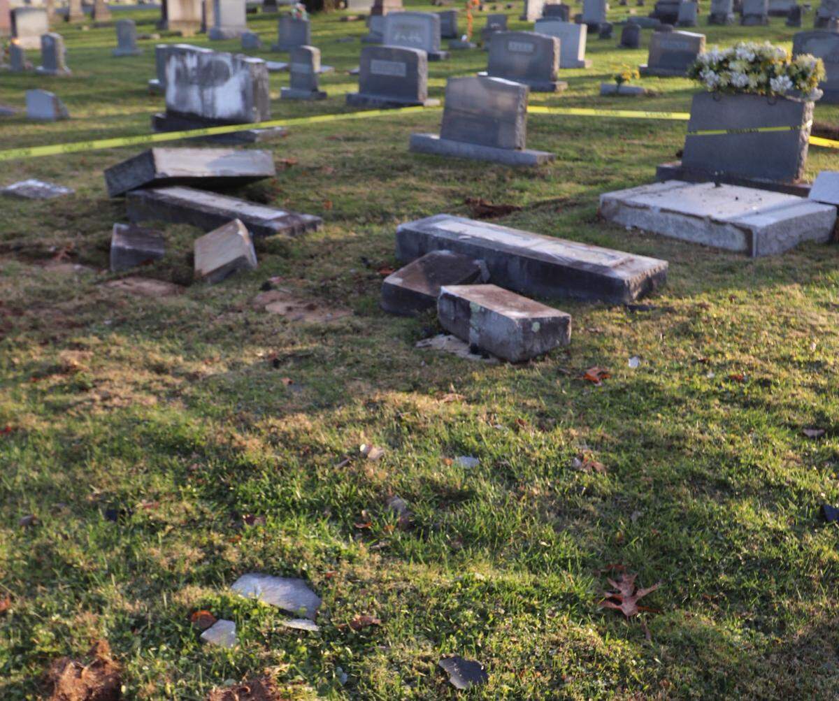 A truck that tore through the cemetery left about two dozen broken headstones, according to the city of Nicholasville.
