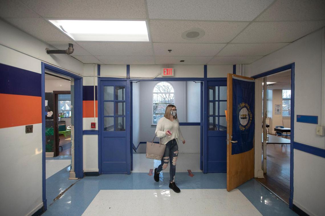 Macy Dungan, a senior at Frankfort High School in Frankfort, Ky., walks to her first class on Monday, Feb. 8, 2021, the first day senior students were allowed to attend in-person classes at the school in nearly a year.