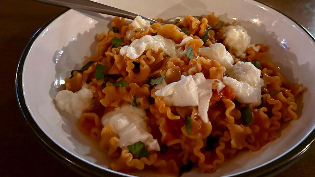 Mafaldine corte pasta dish ($25) at Mileta is made with a rich tomato sauce and topped with Italian buffalo mozzarella and basil. The fresh mozzarella for the dish is shipped overnight from Italy to their supplier in Chicago and is the most expensive ingredient in the kitchen per pound.