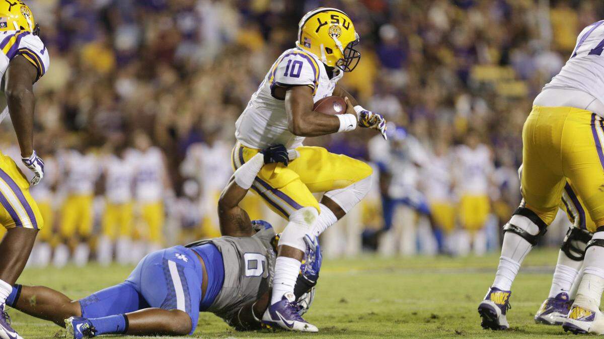 Kentucky's Jason Hatcher sacked LSU's Anthony Jennings in 2014. The former Trinity High School star is serving a two-game suspension for an unspecified violation of team rules.