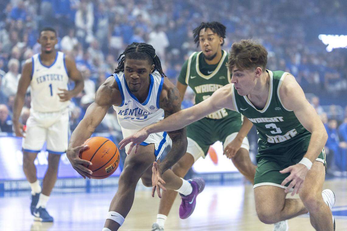 Kentucky’s Otega Oweh (00) drives as Wright State’s Alex Huibregtse (3) defends during Monday’s game at Rupp Arena. Oweh led UK with 21 points in its season-opening win.