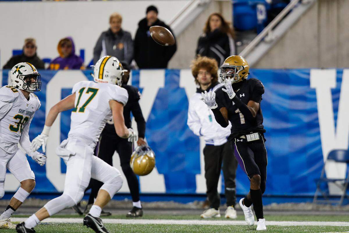 Male’s Vinny Anthony (1) catches a pass against St. Xavier during the 6A state football championship at Kroger Field on Dec. 5. Anthony, a Wisconsin commit, had 129 yards and two touchdowns receiving in the game.