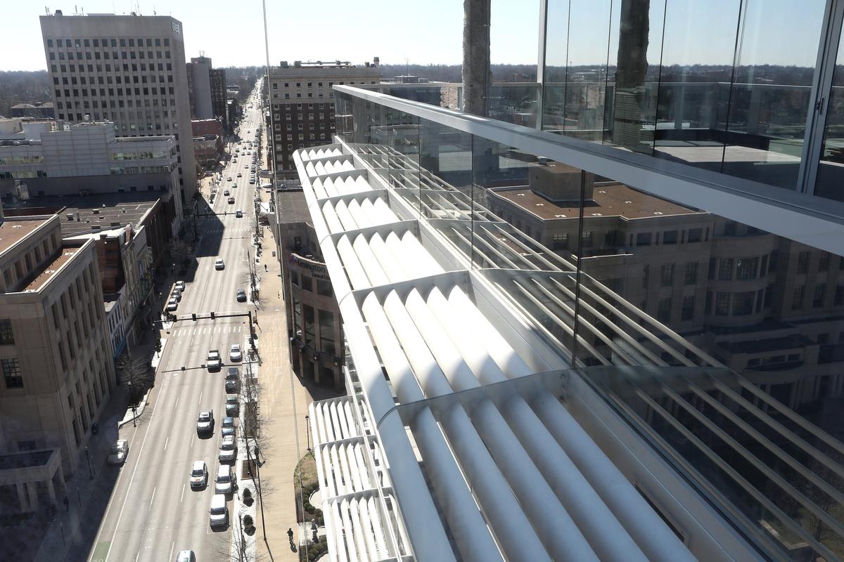 Sunscreens with LED lighting, which will illuminate the structure at night, extended from the balcony of a condominium Wednesday at City Center in Lexington. The color of the light can be changed for special occasions.