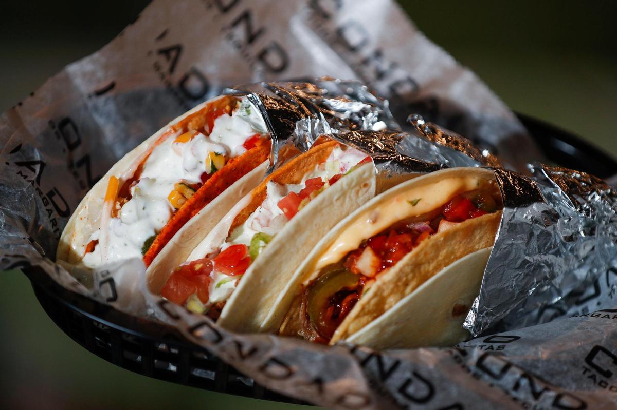 Signature tacos including, from left, the Lucy’s Fire made with sweet and firecracker shell, roasted chicken lettuce, cilantro, onions, Middlefield cheddar cheese, corn salsa and cilantro-lime aioli; the Blue Dream, made with flower and Kewl ranch shells, queso blanco, ground beef, lettuce, tomatoes and avocado ranch sauce; and the Korean BBQ Pork Taco, made with a flour and hard corn shell, smoked cheddar queso, slow roasted pulled pork, gochujang bbq sauce pickled jalapeños, and pineapple salsa.