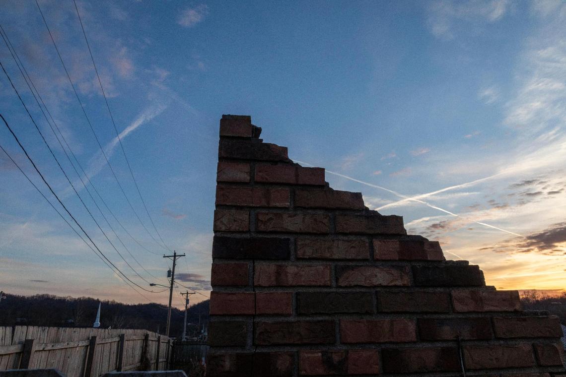 Bricks from a building that was damaged at the corner of Main Street and Court Street by the 2012 tornado and was never rebuilt in West Liberty, Ky., Wednesday, December 15, 2021.
