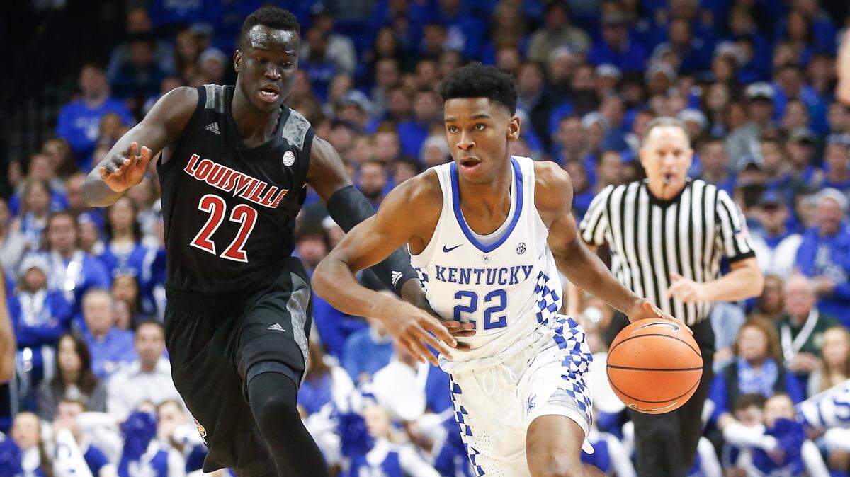 Kentucky guard Shai Gilgeous-Alexander drove against Louisville's Deng Adel in UK's 90-61 win last season.