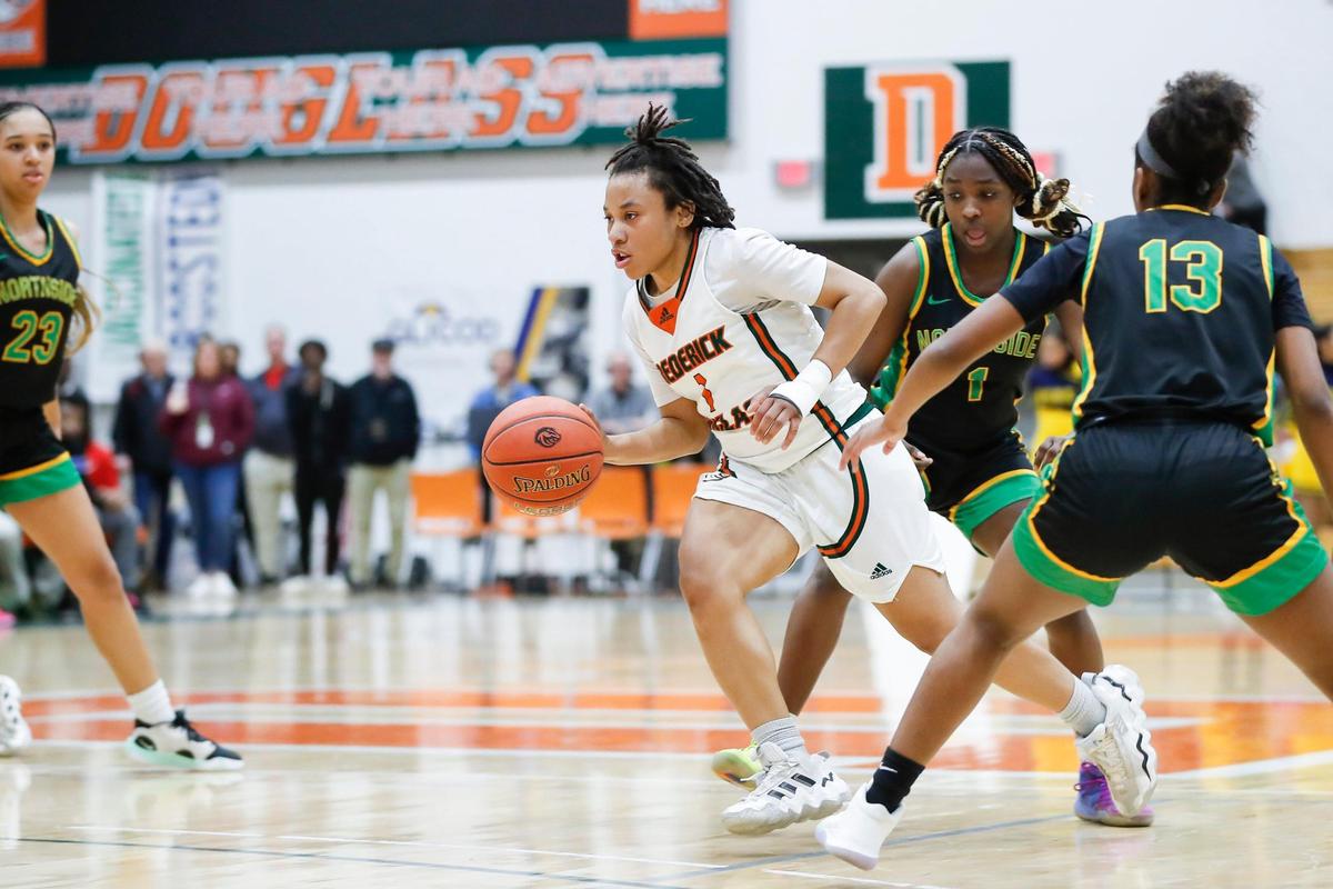 Jermyra Christian of Frederick Douglass drives for a basket against Bryan Station in Friday night’s win. Christian led the Broncos with 20 points.