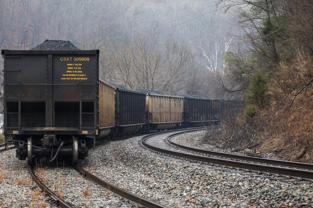 Miners, who say they haven’t been paid in three weeks, block a coal train in Pike County, Ky., Tuesday, Jan. 14, 2020.