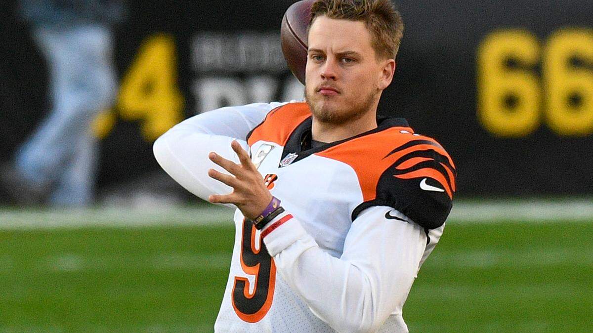 Cincinnati Bengals quarterback Joe Burrow (9) warms up before an NFL football game. Burrow’s 71.25-point game last week was a season-high and fourth best single game in the 24-year history of the Miami Herald’s NFL quarterback rankings.