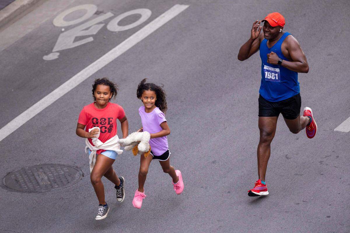 A trio of runners prepared to cross the finish line Thursday morning in Lexington.