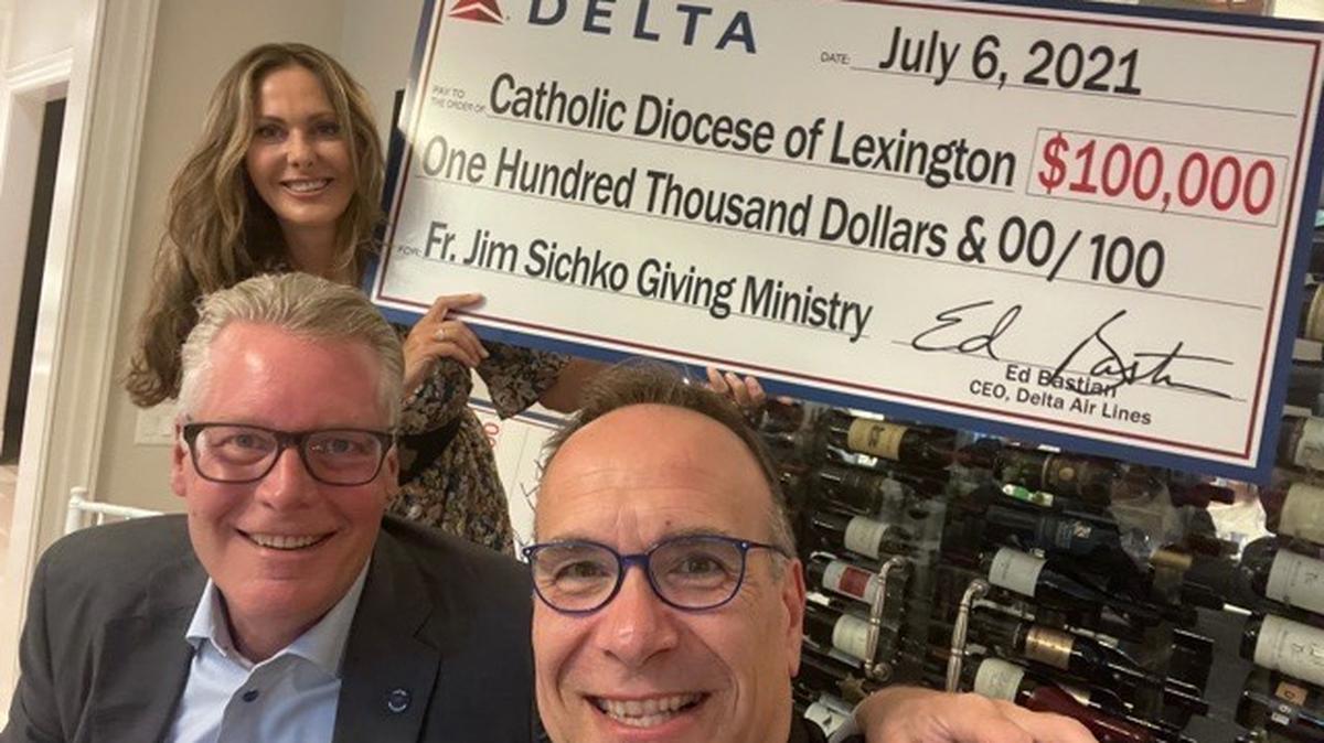 Rev. Jim Sichko received a check from Delta Airlines for his acts of kindness. The money will be used to deliver 1,000 pounds of meat to God’s Pantry food bank.