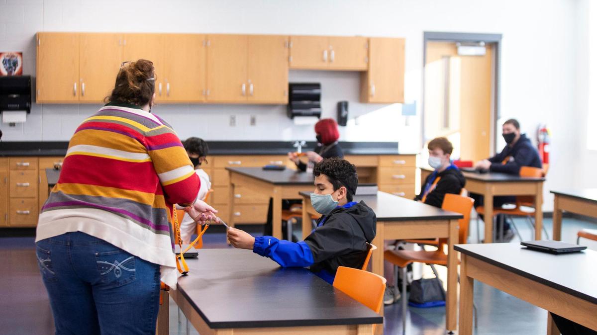 Students sit at individual desks in a classroom during the first day of returned in-person learning at Frederick Douglass High School in Lexington, Ky, Monday, March 8, 2021. Every classroom has desk shields that can be made available to students upon request.
