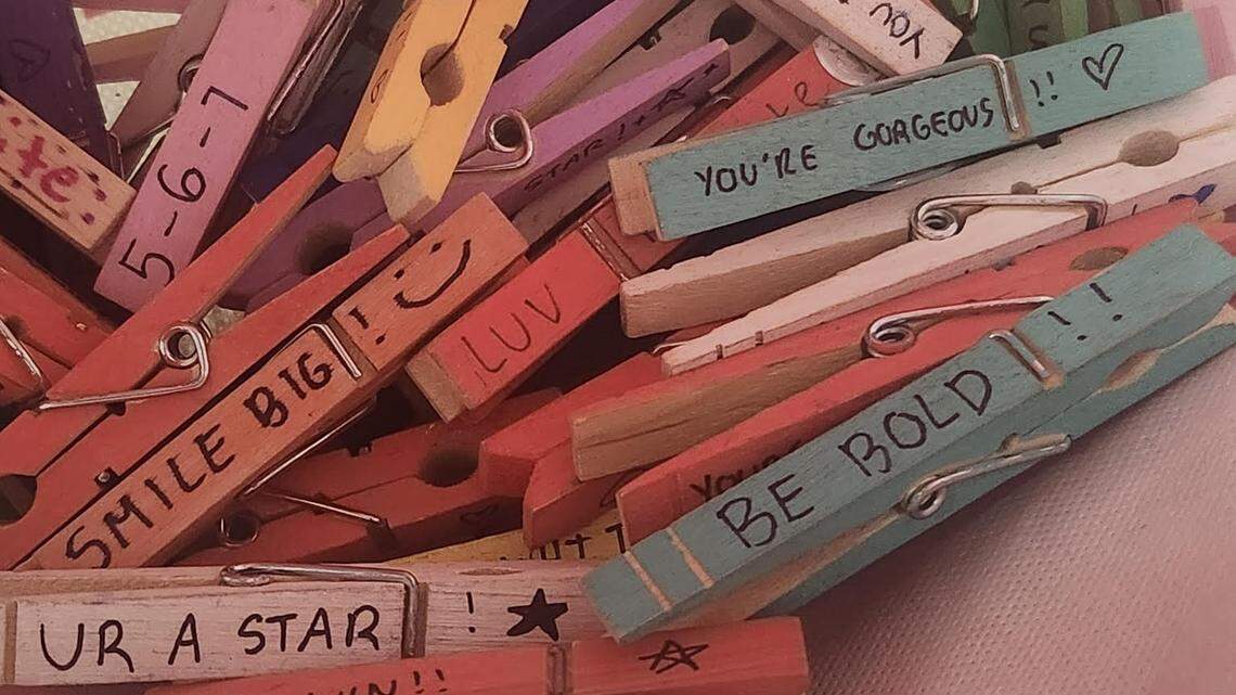 Players in girls volleyball clubs all over Kentucky and the country are spreading kindness by clipping clothespins bearing positive affirmations on competitors and spectators.