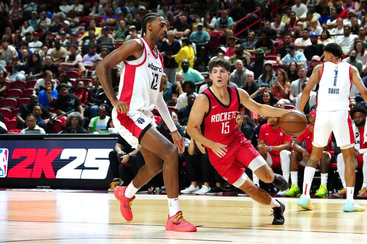 Reed Sheppard, the No. 3 pick in last month’s NBA draft, drives around Washington’s Alex Sarr, the No. 2 pick, during Sunday night’s game.