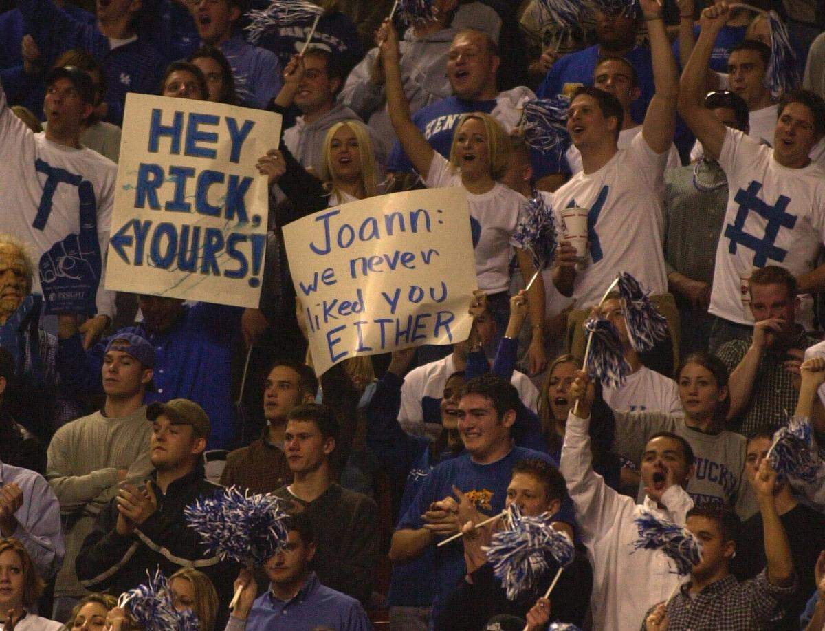 Kentucky fans brought signs to Rupp Arena for Rick Pitino’s first game there as Louisville coach in 2001, including one targeting his wife, Joanne.