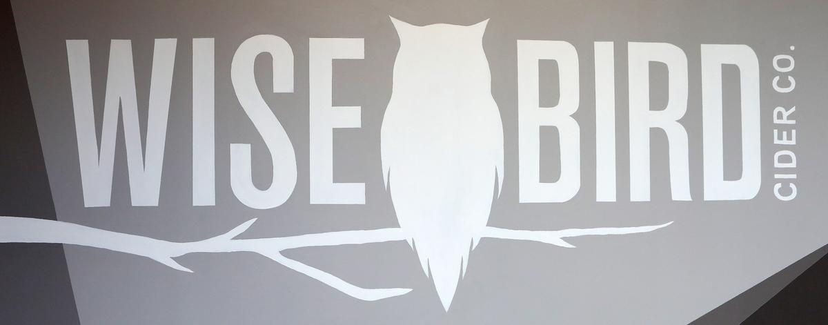 Mural logo Friday at Wise Bird Cider Co., which opens June 7 in the Pepper Distillery District. Photo by Matt Goins